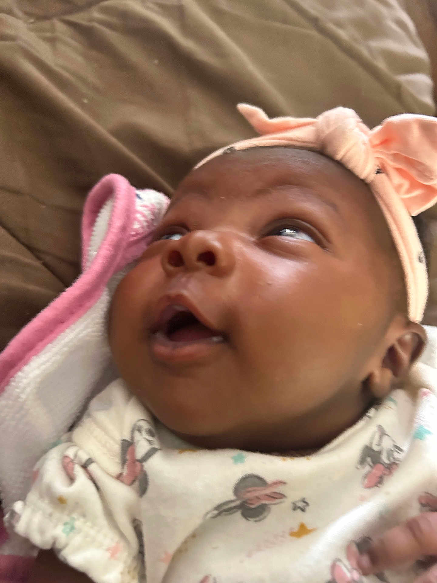 Kybria joined the competition — help win amazing prizes! baby, infant, headband, bow, clothing, blanket, face, expression, looking_up, closeup, soft, cute, patterned_outfit, child, newborn, indoors, person, skin, head, cozy