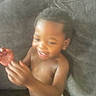 Zarie is registered to the contest to win money with this photo: toddler, child, smiling, clapping, indoor, couch, diaper, baby, happy, young_child, person, skin, face, hair, seated, hands, furniture, home, casual, blurred