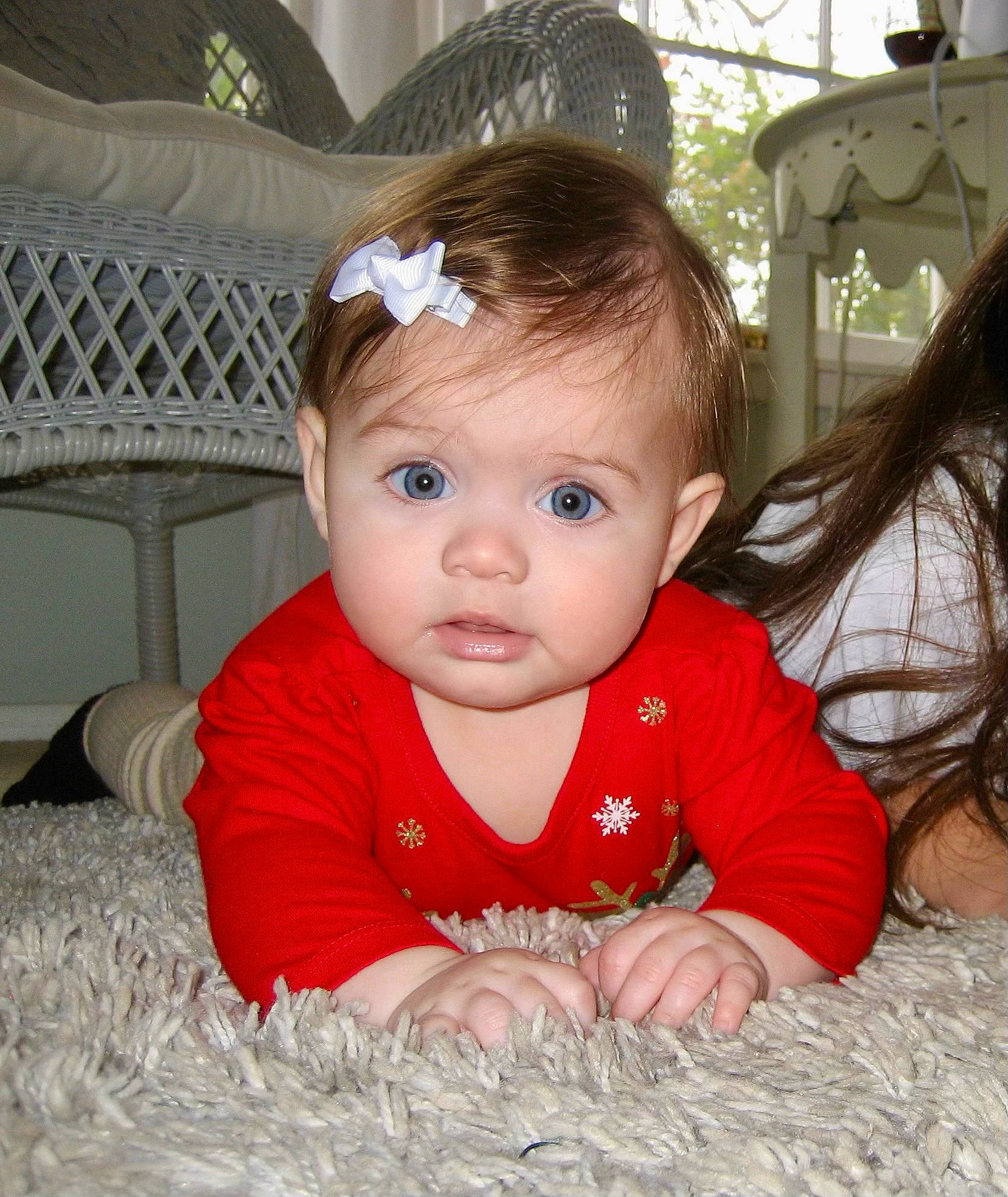 Avaya joined the competition — help win amazing prizes! baby, baby_toddler_clothing, cheek, child, chin, eye, eyebrow, facial_expression, flooring, fun, grass, happy, iris, person, product, sitting, skin, sleeve, smile, toddler