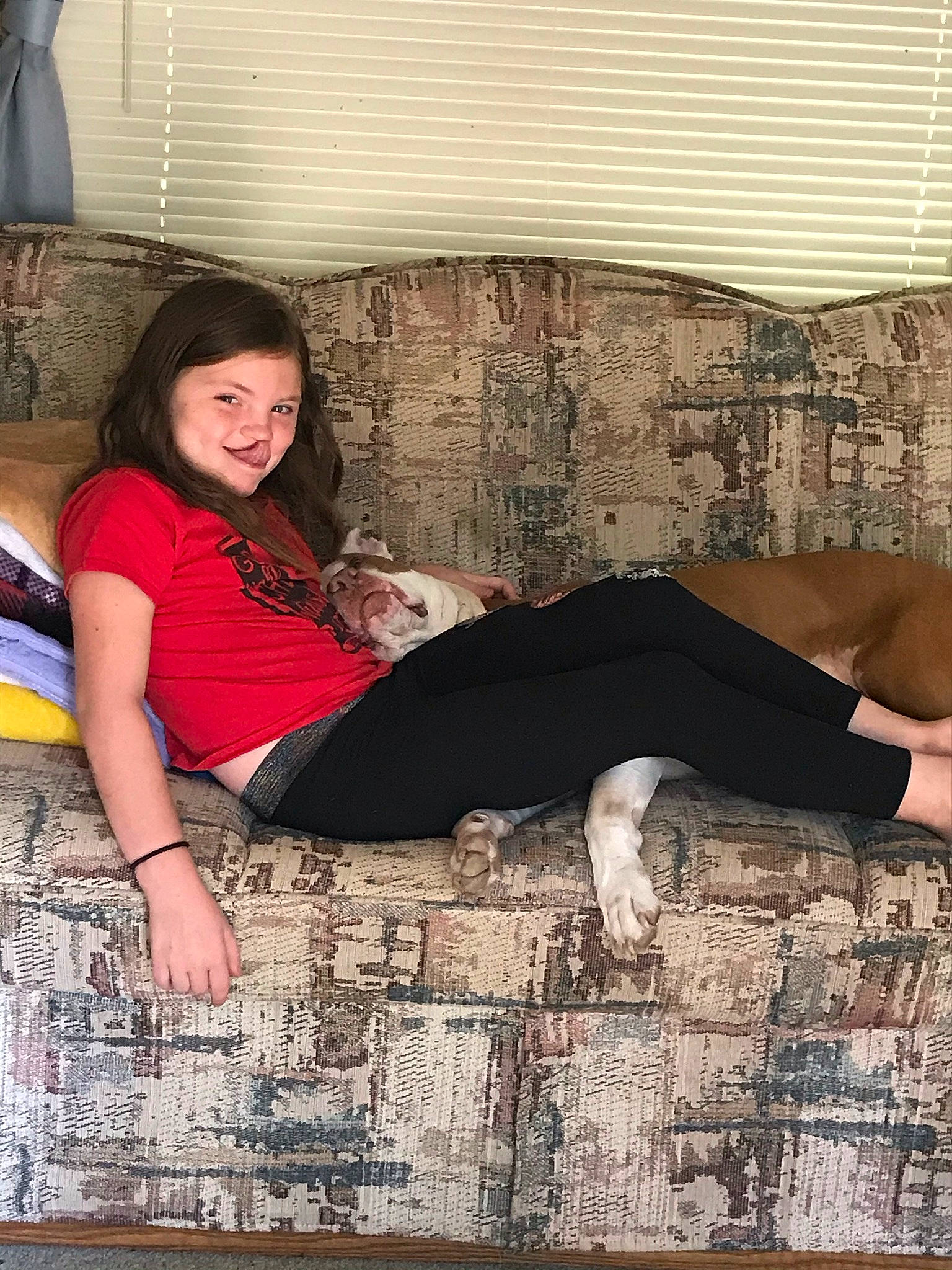 Remington is registered to the contest to win money with this photo: black_hair, comfort, fashion_design, flash_photography, flooring, foot, hair, happy, human_leg, joint, joy, knee, long_hair, pattern, person, smile, textile, thigh, trunk, waist