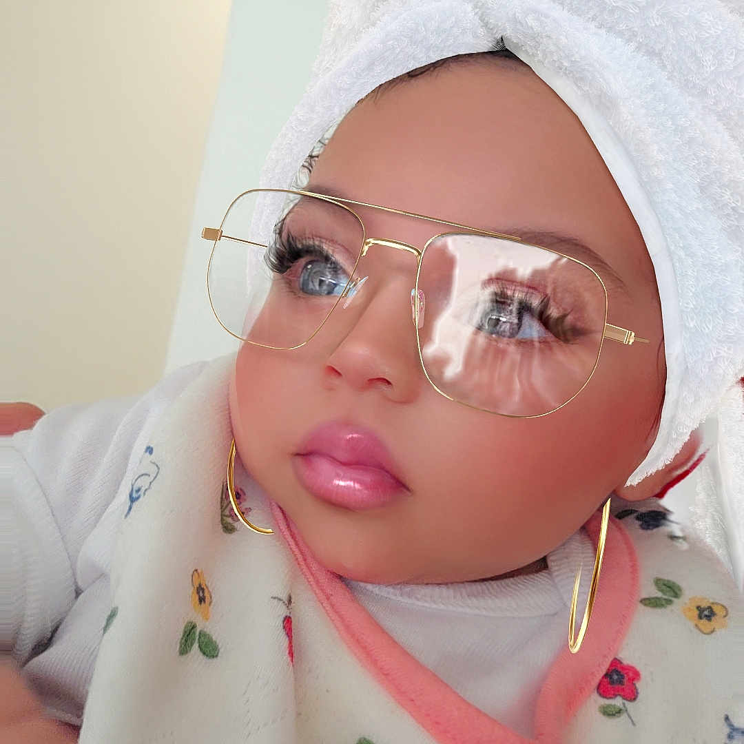 Sky is registered to the contest to win money with this photo: baby, towel, bib, glasses, earrings, face, child, portrait, indoor, cute, fashion, accessories, toddler, clothing, closeup, expression, skin, headwear, eyewear, person