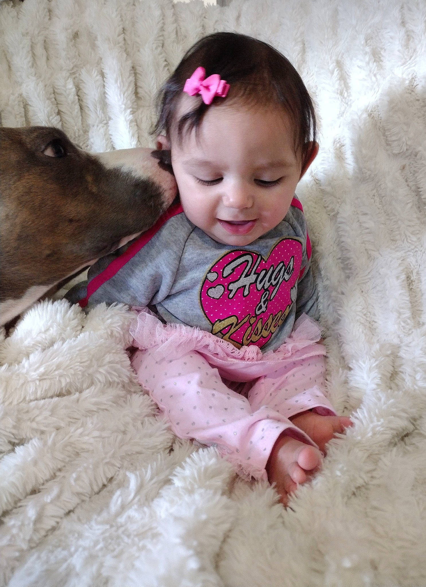 Jade is registered to the contest to win money with this photo: baby, baby_toddler_clothing, beauty, child, companion_dog, fun, fur, happy, iris, magenta, pattern, person, pink, portrait_photography, sitting, skin, sleeve, smile, textile, toddler