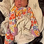 Estella joined the competition — help win amazing prizes! baby, infant, onesie, floral_pattern, blanket, soft_fabric, sleepwear, cute, portrait, child, newborn, indoor, resting, wide_eyes, curious, lying_down, cozy, colorful, comfort, warm
