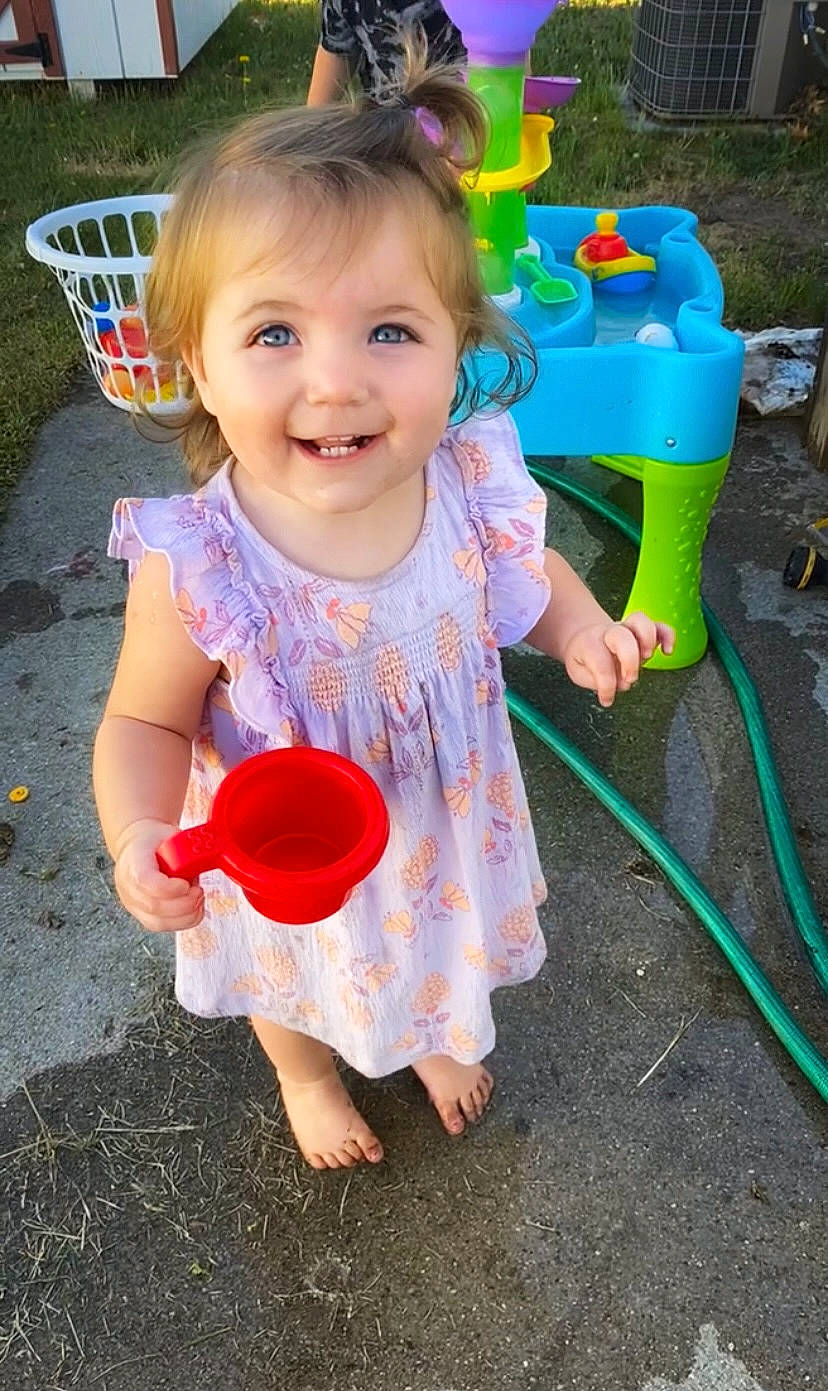 Raelyn is registered to the contest to win money with this photo: baby, baby_playing_with_toys, baby_toddler_clothing, child, facial_expression, fun, grass, happy, head, human_settlement, joy, leisure, person, photograph, pink, play, smile, summer, t_shirt, toddler
