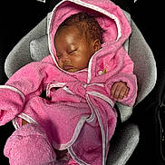 Nalyla is registered to the contest to win money with this photo: baby, sleeping, pink_robe, hooded, car_seat, infant, cozy, soft_lighting, cute, child, peaceful, bundle, clothing, footwear, indoor, portrait, relaxation, toddler, seat, adorable