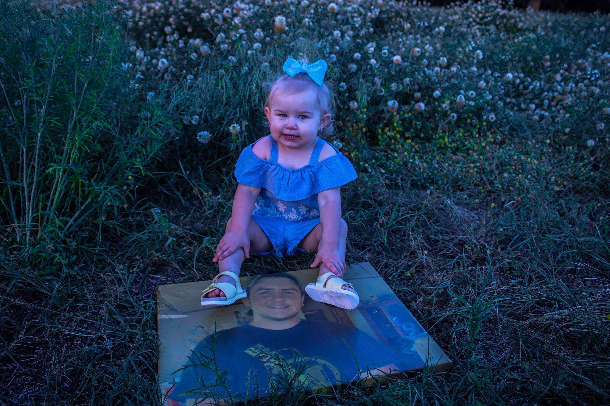 Raliegh joined the competition — help win amazing prizes! azure, baby_toddler_clothing, blue, botany, child, electric_blue, fun, garden, grass, grassland, headwear, joy, landscape, leisure, nature, people_in_nature, person, plant, recreation, sitting