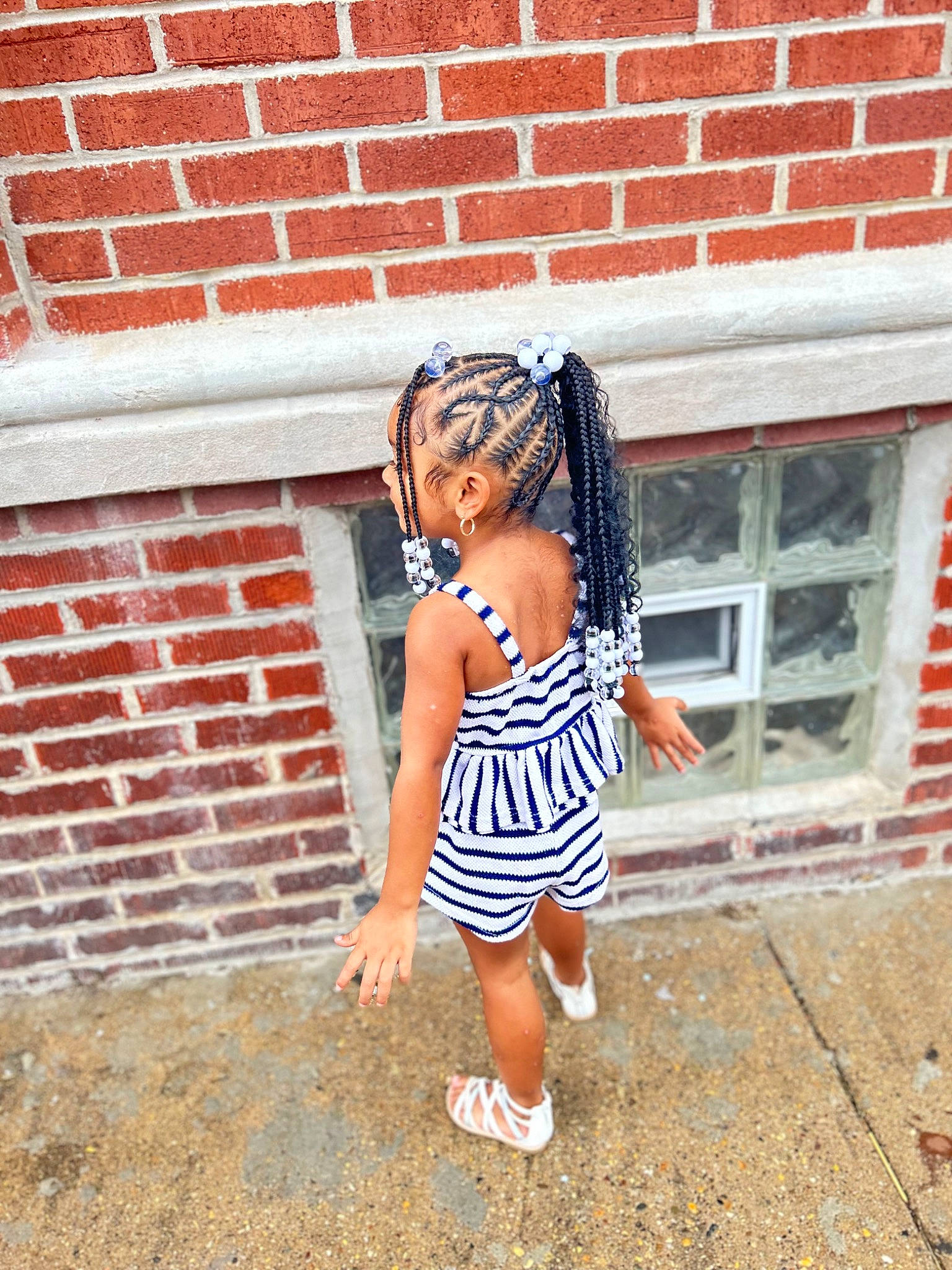 Legacy joined the competition — help win amazing prizes! baby_toddler_clothing, brick, brickwork, child, electric_blue, eyewear, flooring, fun, happy, human_leg, pattern, person, sandal, sidewalk, toddler, toy, visual_arts, waist, water, window