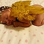 Melhya participe au concours pour gagner de l'argent avec cette photo : baby, baby_sleeping, child, hair_accessory, headband, nap, sleep, toddler, yellow
