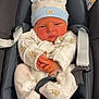 baby, infant, car_seat, hat, onesie, clothing, baby_clothes, cute, child, seat_belt, pacifier, indoor, newborn, portrait, baby_accessory, baby_hat, baby_onesie, sitting, child_seat, serious_expression