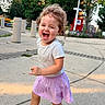 Emilia And Olivia joined the competition — help win amazing prizes! child, toddler, smiling, laughing, outdoor, sidewalk, park, city, street, curly_hair, portrait, standing, walking, purple_skirt, gray_shirt, sandals, flowers, trees, mailbox, sunlight