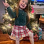 Mirabella joined the competition — help win amazing prizes! child, girl, christmas_tree, holiday, presents, plaid_skirt, green_sweater, red_shoes, bow, long_hair, smiling, pose, wood_floor, ornaments, lights, necklace, living_room, fireplace, festive, decorations