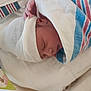 newborn, baby, sleeping, blanket, hospital, hat, bed, infant, hand, wrapped, cozy, cute, face, person, resting, soft, hospital_room, child, peaceful, closeup