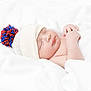 baby, newborn, sleeping, hat, pom_pom, blanket, white, soft, cozy, infant, peaceful, cute, child, resting, knit, warm, portrait, closeup, skin, hand