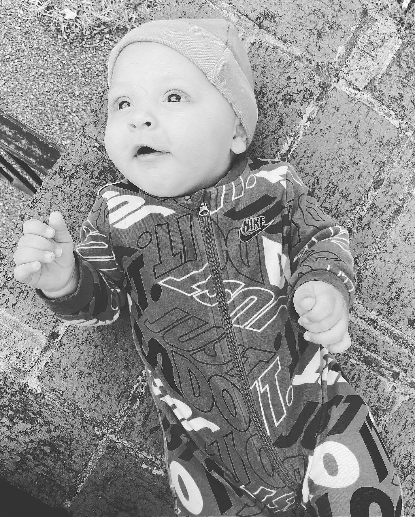 Malachi joined the competition — help win amazing prizes! baby, baby_toddler_clothing, black_and_white, child, cool, flash_photography, grass, happy, headgear, headwear, monochrome, monochrome_photography, pattern, person, personal_protective_equipment, photograph, sitting, smile, stock_photography, style