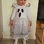 toddler, child, smiling, dress, costume, ghost, halloween, indoor, floor, wall, socks, happy, cute, standing, person, clothing, young_child, portrait, home, fun