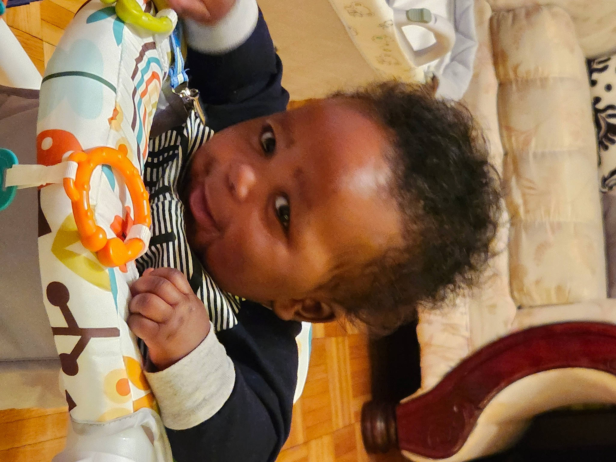 Elijah is registered to the contest to win money with this photo: child, event, eyelash, fun, happy, leisure, musical_instrument, nose, person, play, room, toddler, tree