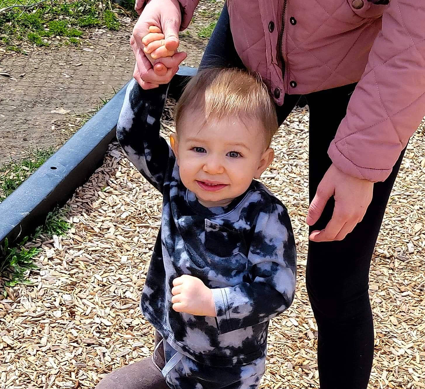 Damien is registered to the contest to win money with this photo: baby, baby_toddler_clothing, event, eye, finger, formal_wear, fun, gesture, grass, hairstyle, happy, head, holding_hands, joy, leaf, people_in_nature, person, skin, sleeve, smile