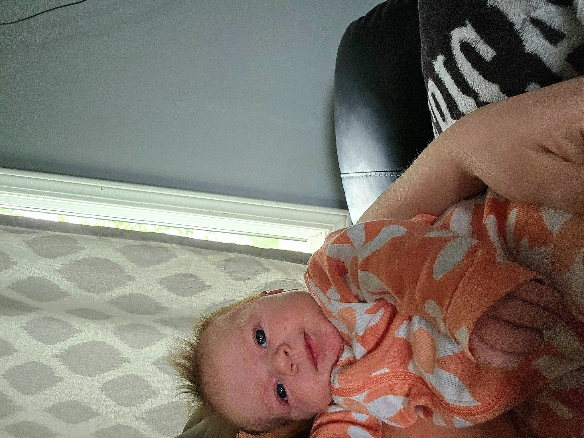 Layla is registered to the contest to win money with this photo: baby, baby_products, baby_toddler_clothing, cheek, child, comfort, elbow, finger, flesh, flooring, foot, gesture, human_body, human_leg, mouth, nail, person, sitting, skin, thumb