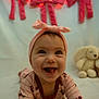 baby, bow, bunny, cherry_pattern, child, closeup, crawling, cute, fairy_lights, happy, headband, indoor, infant, onesie, pink, plush_toy, portrait, red_bows, smiling, soft_background