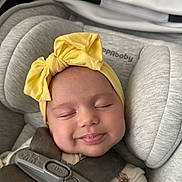 Beatrice joined the competition — help win amazing prizes! baby, smiling, headband, yellow_bow, car_seat, straps, closed_eyes, child, infant, cute, soft_lighting, face, happy, comfort, clothing, floral_pattern, seatbelt, portrait, indoors, sleepy