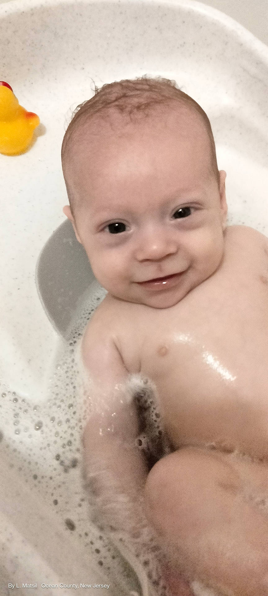 baby, bath, bathtub, bubbles, child, cute, face, foam, fun, happy, head, infant, inside, person, playful, rubber_duck, skin, smile, water, wet