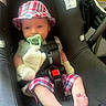 Silas Jericho Day joined the competition — help win amazing prizes! baby, car_accessory, car_seat, child, clothing, cute, feet, foot, hat, indoor, infant, pacifier, person, plaid, plush_toy, safety, seatbelt, shorts, sitting, young