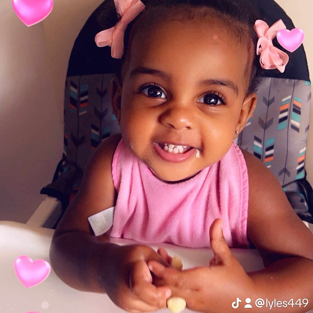 Trayana is registered to the contest to win money with this photo: baby, balloon, bodypart, face, finger, flower, hand, happy, head, heart, laughing, mouth, person, petal, photography, plant, portrait, purple, smile, teeth