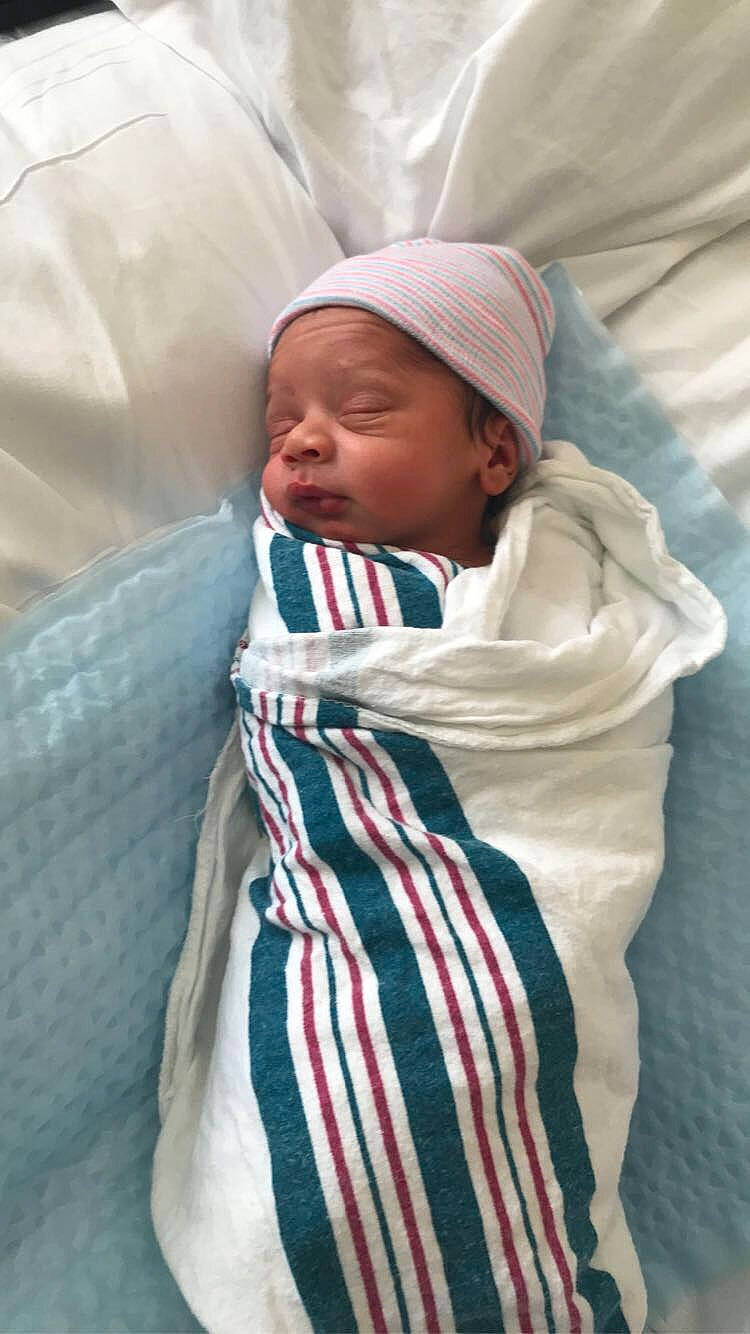 Luliani is registered to the contest to win money with this photo: baby, baby_products, baby_sleeping, bedding, bedtime, cheek, child, comfort, hat, linens, nap, person, room, scarf, skin, sleeve, textile, thumb, toddler, wool