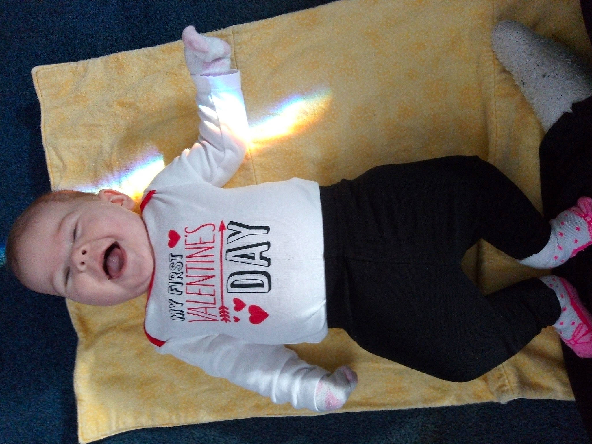 Jenna is registered to the contest to win money with this photo: arm, baby, child, finger, joint, leg, nap, person, toddler