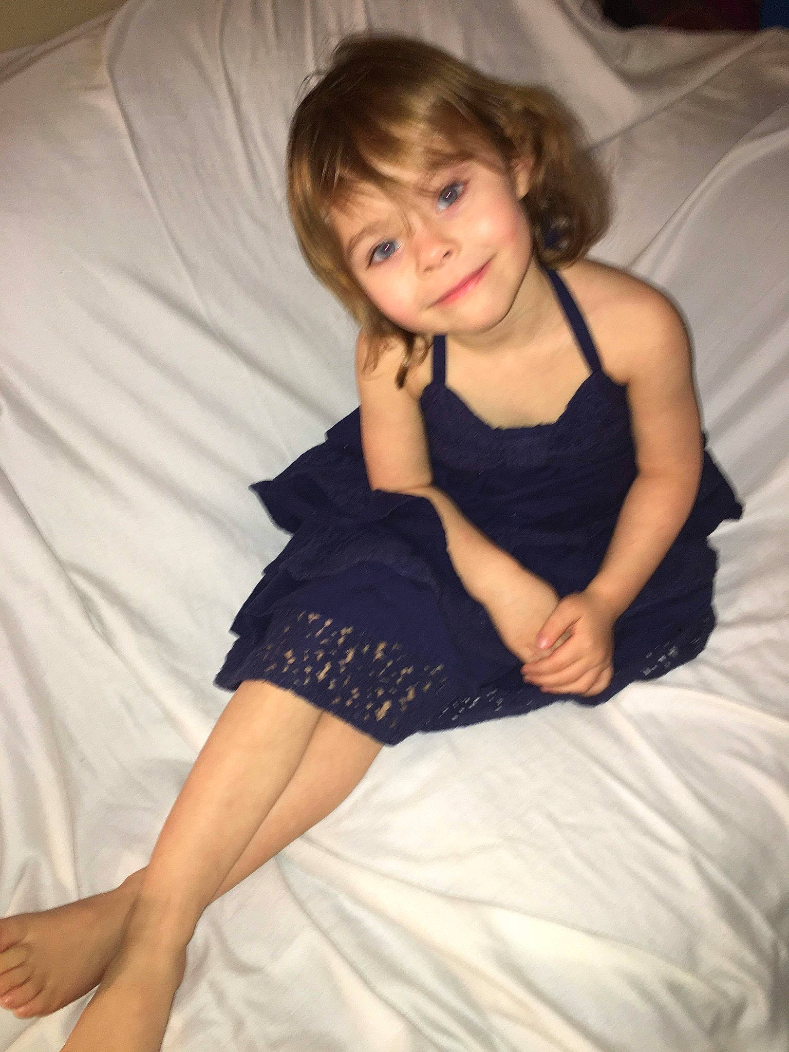 Paisley is registered to the contest to win money with this photo: arm, beauty, brown_hair, child, child_model, dress, finger, furniture, human_body, human_leg, joint, joy, lady, leg, long_hair, person, photo_shoot, shoulder, sitting, skin