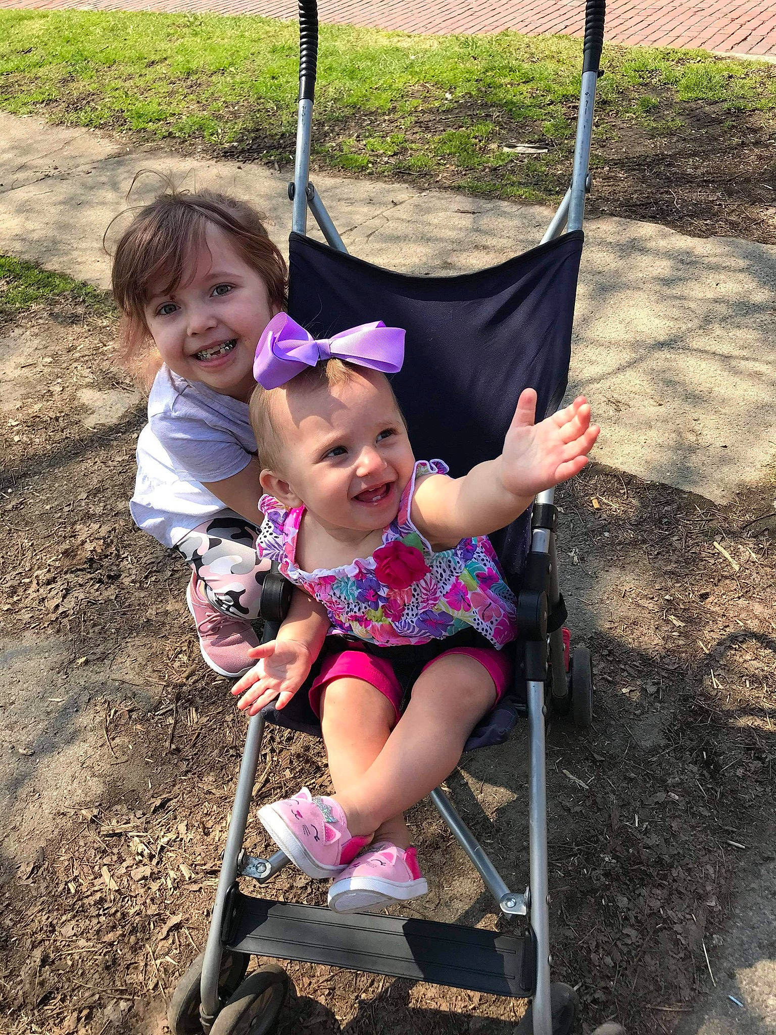 Kadenc is registered to the contest to win money with this photo: baby_toddler_clothing, beauty, child, city, eye, fun, grass, hair, happy, joy, leisure, outdoor_play_equipment, people_in_nature, person, photograph, pink, recreation, shorts, smile, snapshot