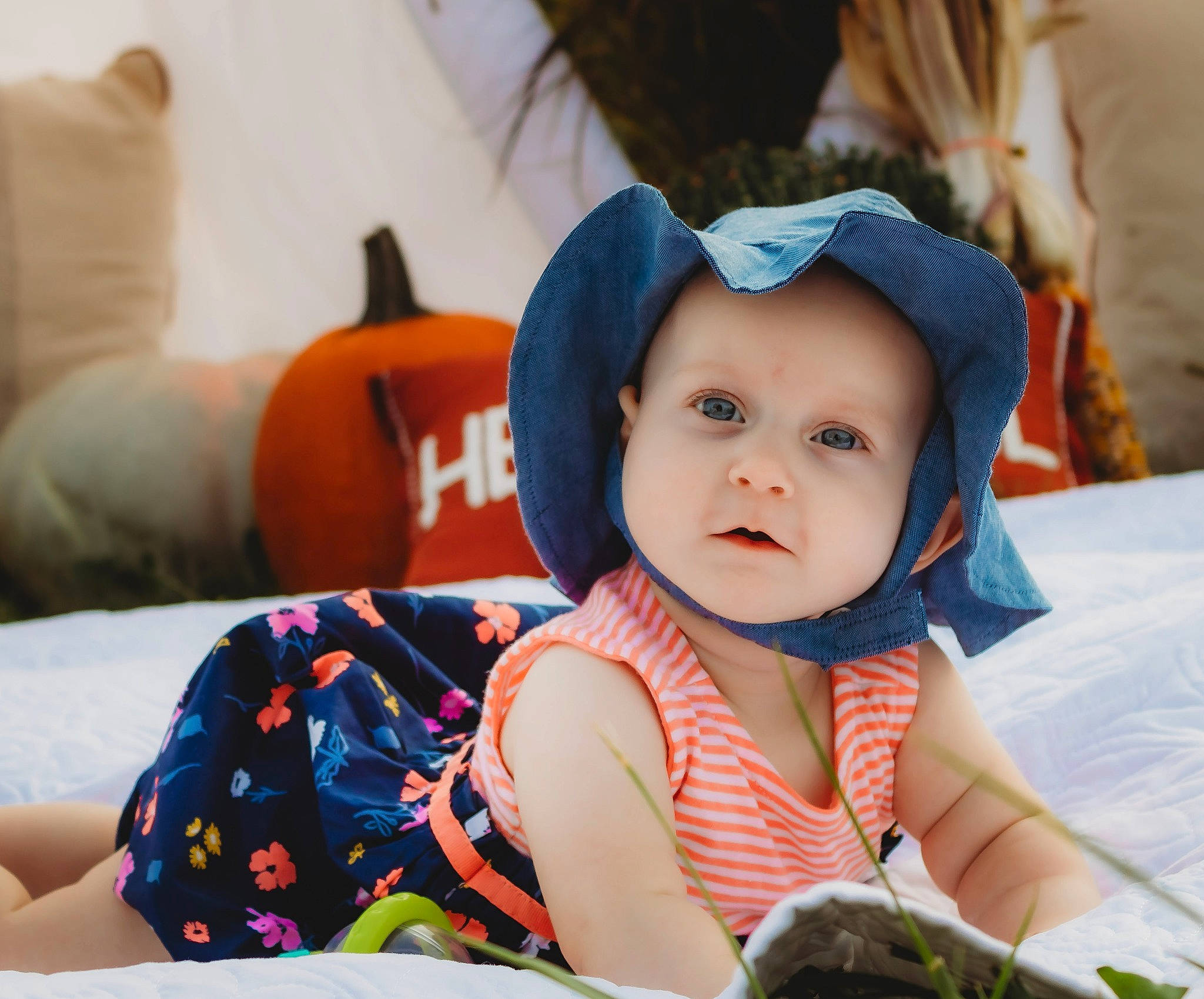 Laya is registered to the contest to win money with this photo: baby, baby_toddler_clothing, beauty, cap, child, comfort, eye, fun, grass, happy, hat, headwear, leisure, mammal, people, person, photograph, sitting, snapshot, sun_hat