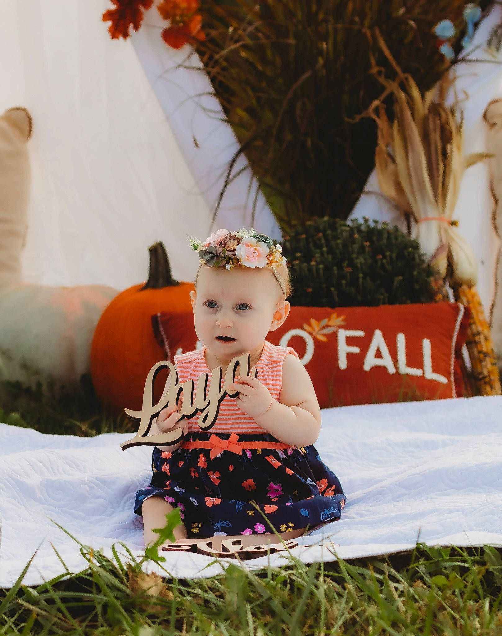 Laya joined the competition — help win amazing prizes! baby, baby_toddler_clothing, calabaza, child, dress, event, fashion_accessory, fun, gourd, grass, happy, headband, headgear, headpiece, leisure, people_in_nature, person, plant, pumpkin, sitting