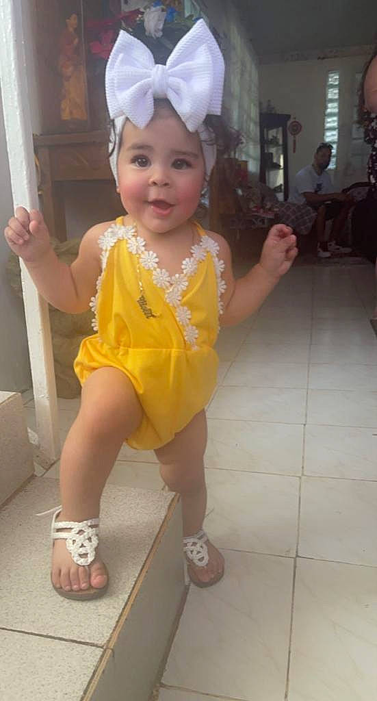 Violet is registered to the contest to win money with this photo: baby, baby_toddler_clothing, child, eye, facial_expression, fun, happy, headwear, human_leg, people, person, photograph, pink, sandal, skin, sleeve, smile, snapshot, thigh, thumb