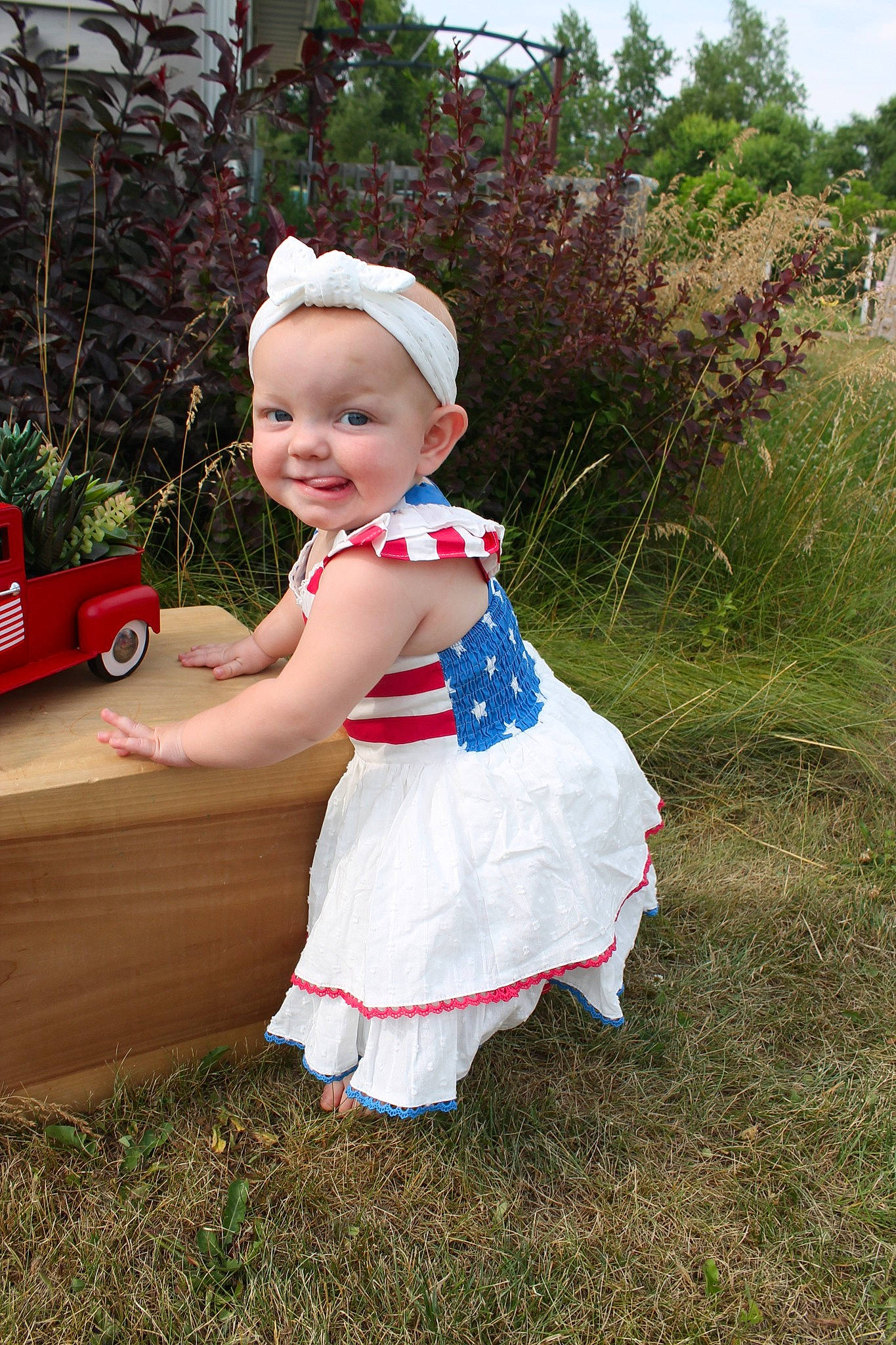 Solei joined the competition — help win amazing prizes! baby, baby_toddler_clothing, child, costume, event, fun, garden, grass, happy, hat, joy, people_in_nature, person, plant, recreation, sitting, sky, smile, sun_hat, toddler