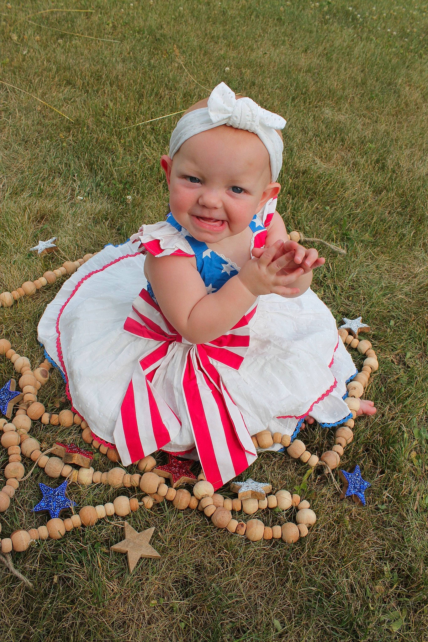 Solei joined the competition — help win amazing prizes! baby, baby_toddler_clothing, dress, event, face, flash_photography, fun, gesture, grass, happy, human_body, joy, lawn, people_in_nature, person, plant, recreation, sitting, smile, soil