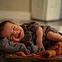 baby, smiling, sleeping, cozy, blanket, bowl, infant, cute, happy, clothing, face, skin, hands, feet, indoors, portrait, newborn, soft, warm, resting