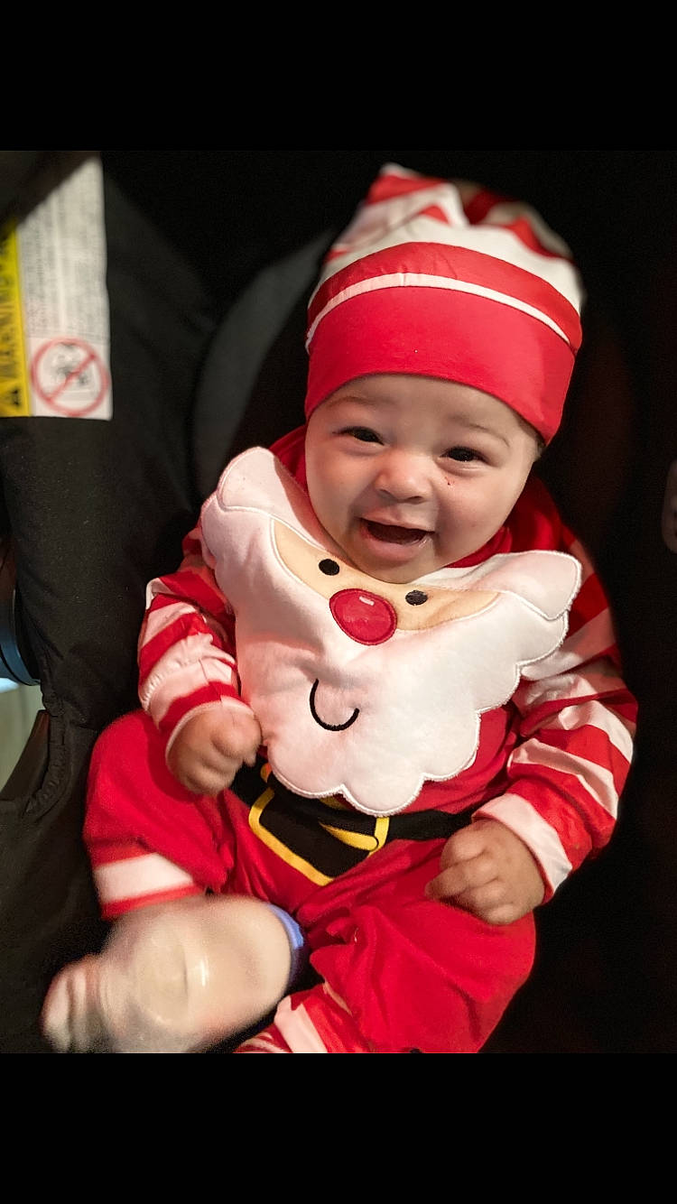 Josiah joined the competition — help win amazing prizes! baby, baby_toddler_clothing, cap, cheek, child, christmas, christmas_eve, comfort, event, fictional_character, fun, happy, hat, headwear, holiday, lap, mouth, person, santa_claus, sleeve