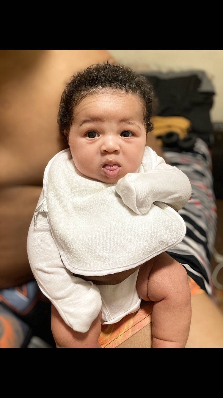 Josiah is registered to the contest to win money with this photo: baby, baby_toddler_clothing, black_hair, cheek, child, comfort, flash_photography, fun, happy, head, human_body, monochrome_photography, nose, person, portrait, portrait_photography, sitting, sleeve, smile, t_shirt