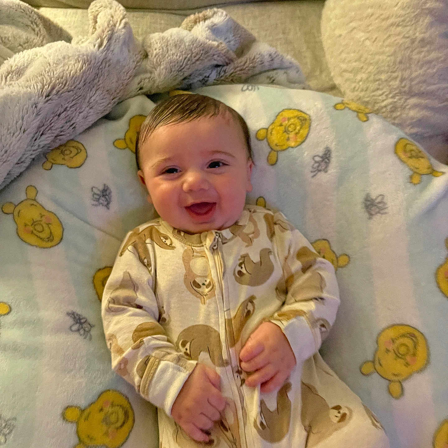 Liam joined the competition — help win amazing prizes! baby, bed, blanket, clothing, couch, crib, cushion, face, furniture, happy, head, homedecor, infantbed, laughing, pajamas, person, photography, portrait, quilt, smile