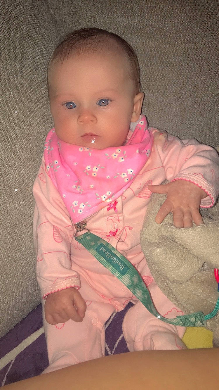 Faith is registered to the contest to win money with this photo: baby, baby_toddler_clothing, cheek, child, comfort, finger, jacket, linens, lip, mouth, neck, nose, outerwear, person, pink, product, skin, sleeve, textile, thumb