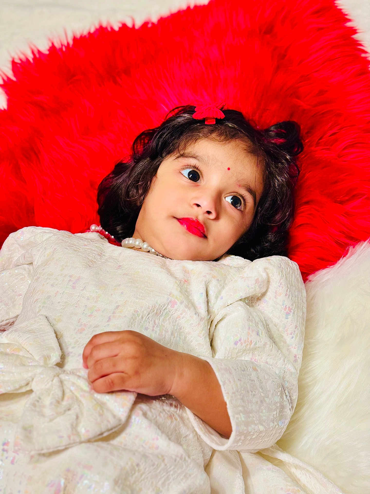 Sreya Sri is registered to the contest to win money with this photo: baby, blanket, bodypart, cosmetics, couch, cushion, doll, face, finger, furniture, hand, happy, head, homedecor, lipstick, person, photography, portrait, smile, toy
