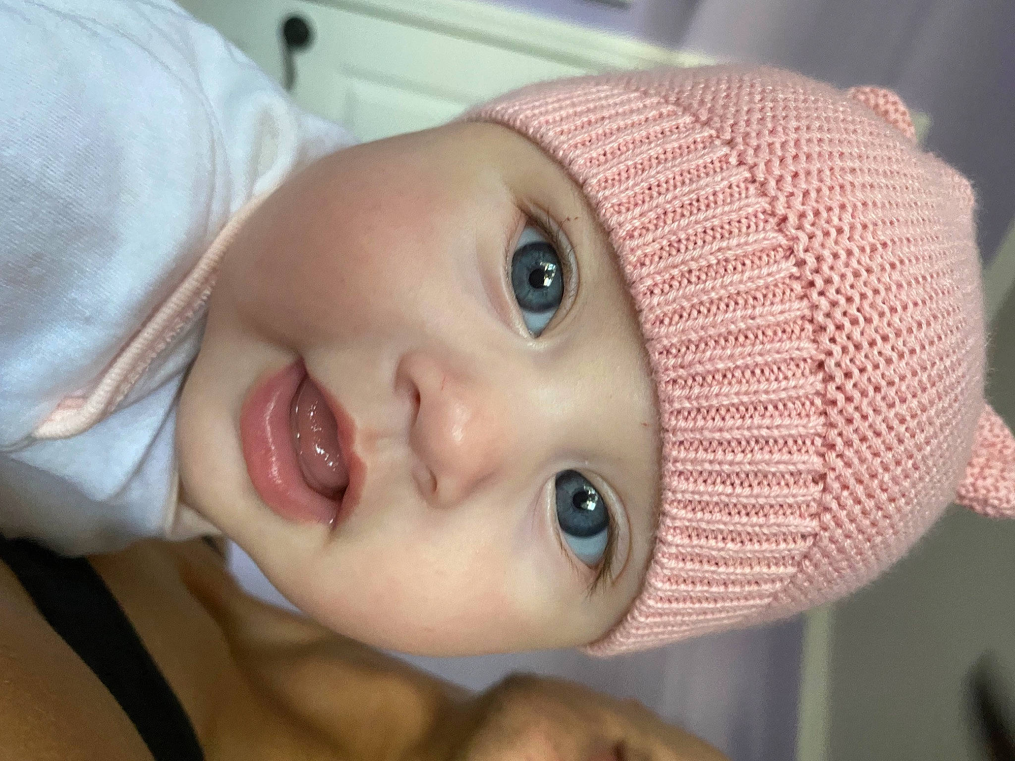 Faith is registered to the contest to win money with this photo: baby, cap, cheek, child, close_up, eye, eyebrow, eyelash, face, fashion_accessory, forehead, happy, headwear, iris, lip, mouth, nose, organ, person, skin