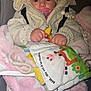 Nayliana a rejoint le concours — aidez-le/la à gagner de superbes lots ! baby, child, infant, car_seat, jacket, hat, blanket, book, toy, pacifier, pink, white, polka_dot, footwear, converse, cute, wide_eyes, indoor, cozy, bundle