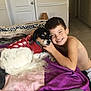 boy, dog, pet, child, smiling, bed, blanket, indoor, happy, canine, fur, cute, red_sweater, carpet, home, portrait, love, affection, comfort, cozy