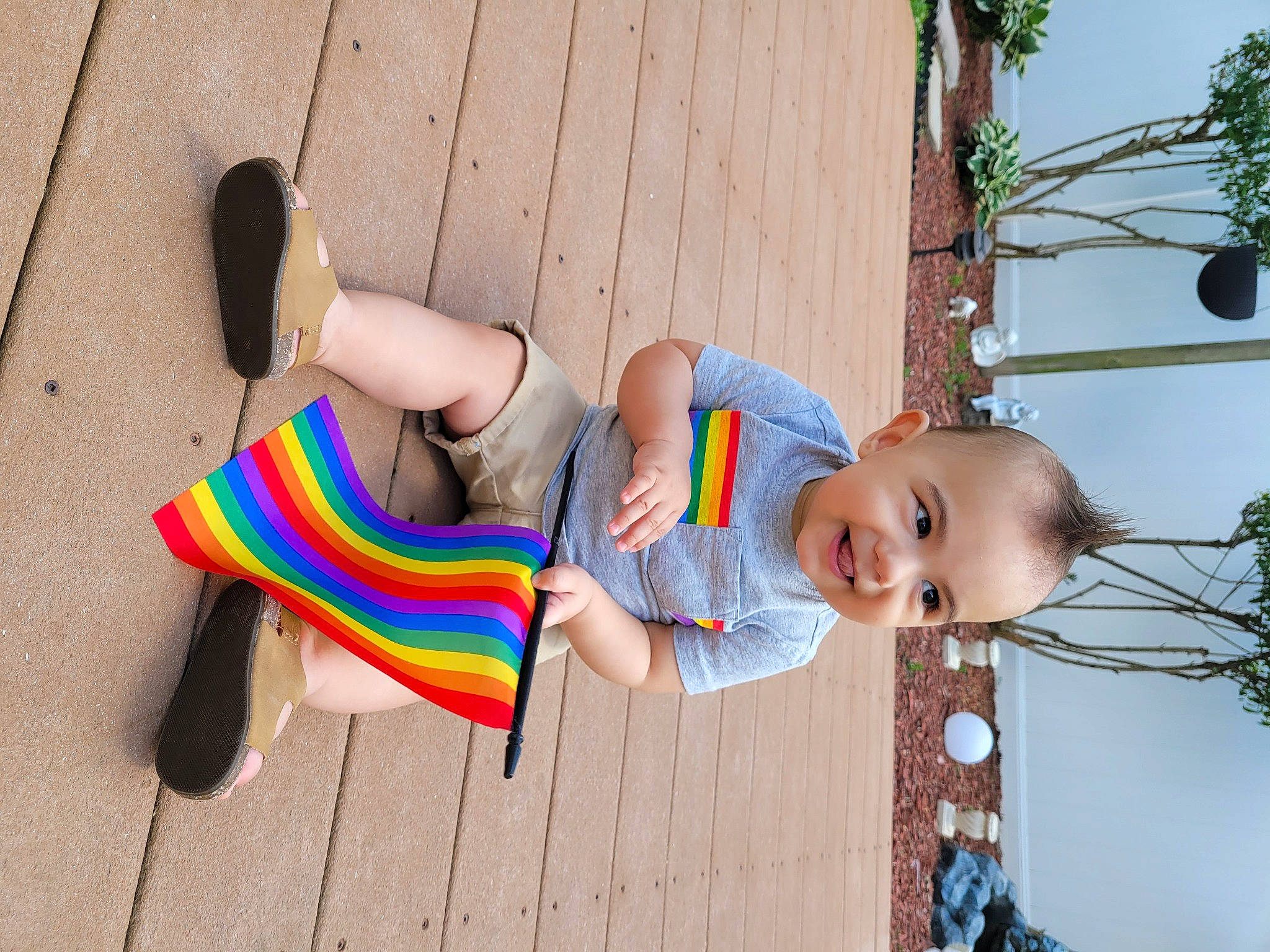 Cristiano is registered to the contest to win money with this photo: arm, baby_toddler_clothing, child, fun, grass, happy, human_body, human_leg, joy, knee, leg, leisure, people_in_nature, person, plant, sandal, sock, thigh, toddler, toy