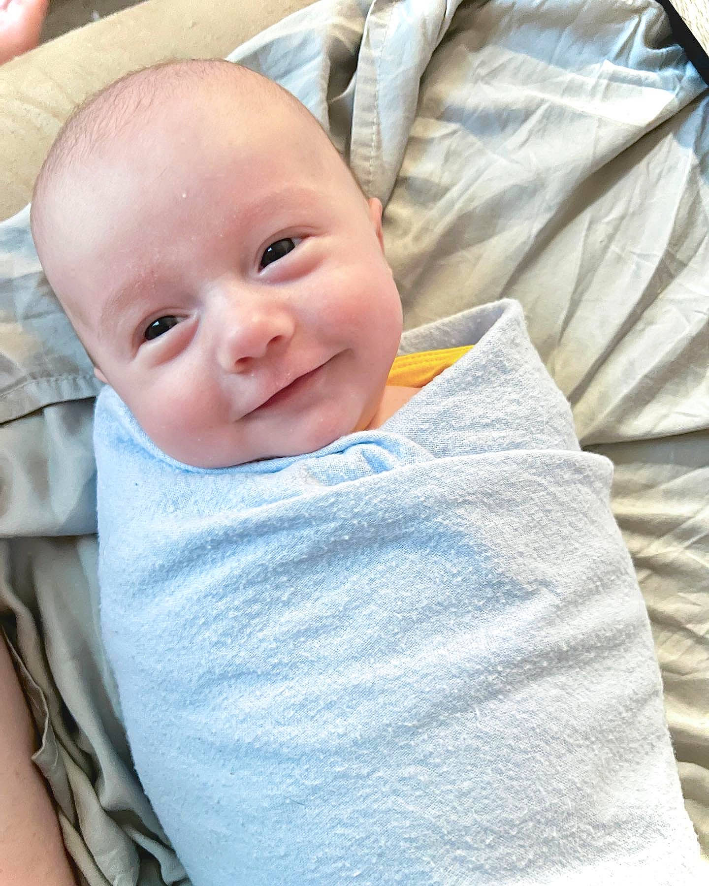 Sawyer is registered to the contest to win money with this photo: baby, baby_toddler_clothing, cheek, child, collar, comfort, electric_blue, happy, iris, joy, linens, lip, pattern, person, product, sitting, sleeve, smile, textile, toddler