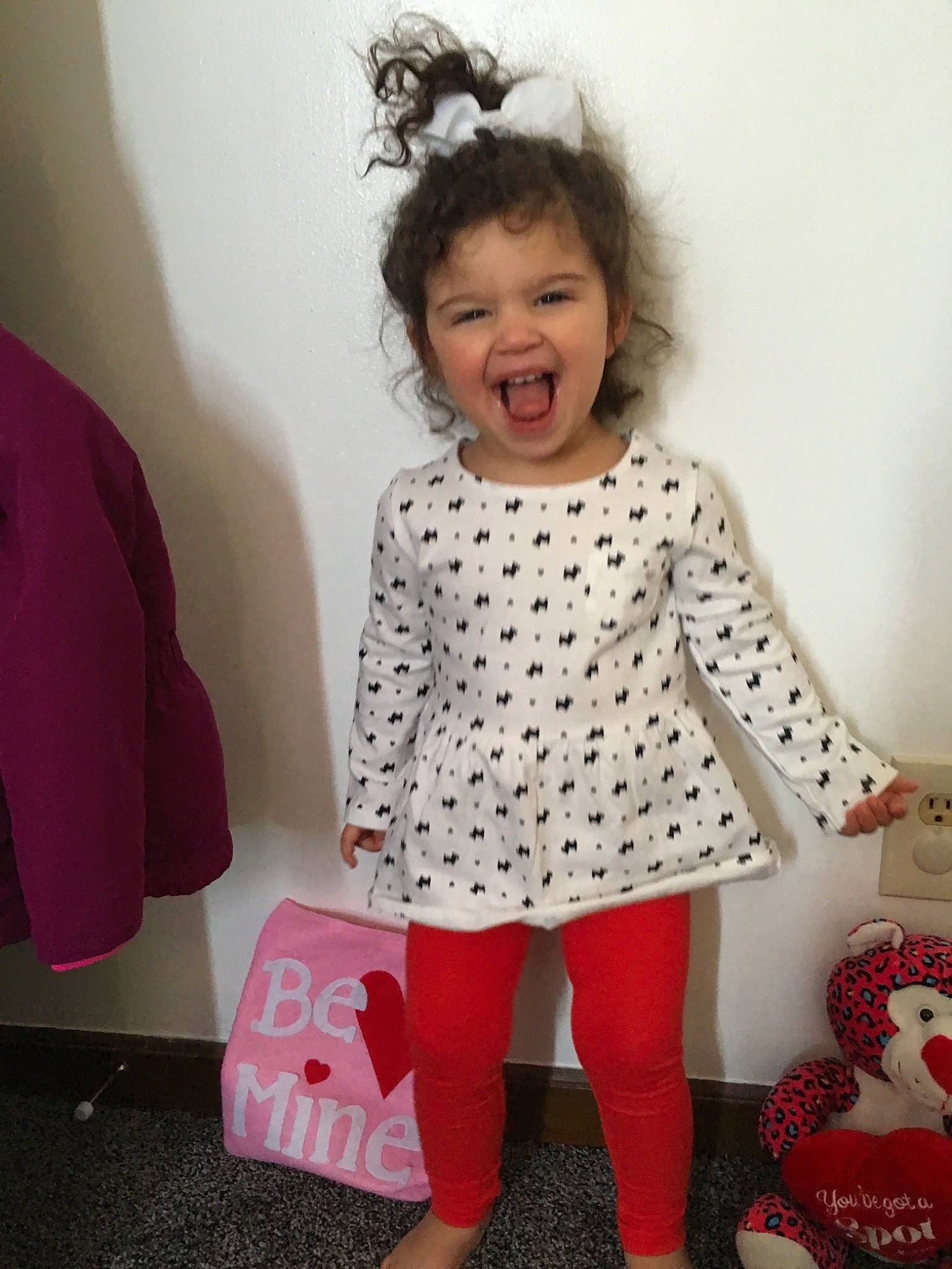 Giana is registered to the contest to win money with this photo: baby_toddler_clothing, child, clothing, design, dress, face, footwear, head, joint, joy, leggings, outerwear, pattern, person, pink, polka_dot, shoe, skin, sleeve, tights