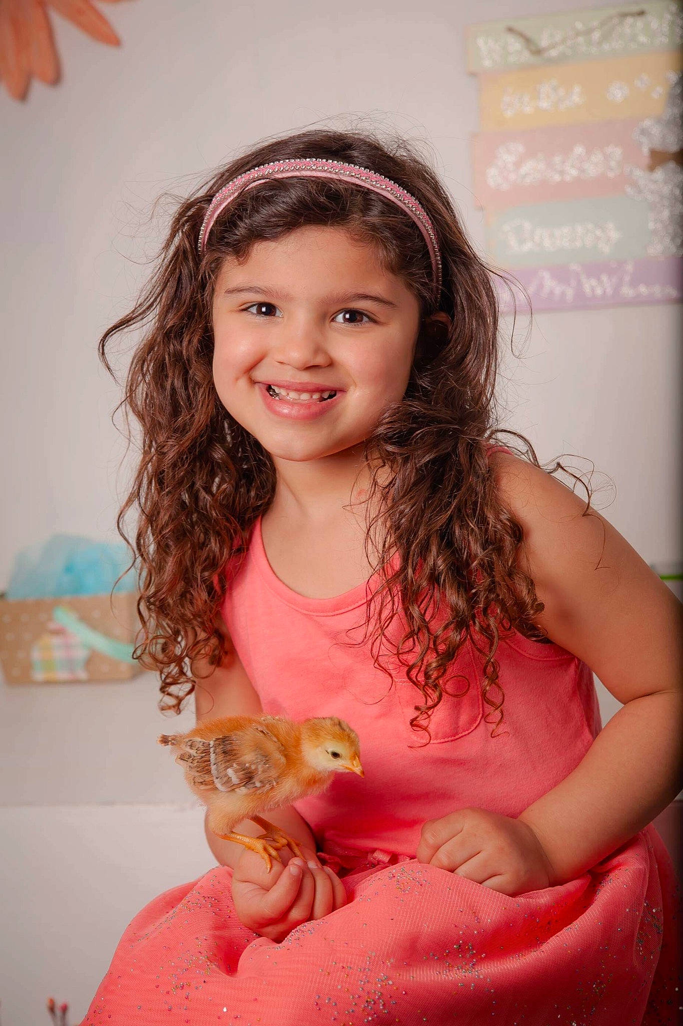 Giana is registered to the contest to win money with this photo: bathing, brown_hair, child, child_model, daughter, face, hair, hair_accessory, happy, headband, joy, lip, long_hair, person, pink, skin, smile, toddler