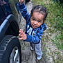 Malakai joined the competition — help win amazing prizes! toddler, child, boy, vehicle, car, hoodie, blue, grass, dirt_path, standing, outdoor, curious, playful, casual_clothing, sneakers, nature, small_person, young_child, daylight, portrait